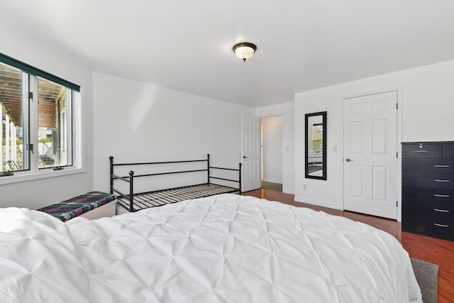 bedroom featuring wood finished floors