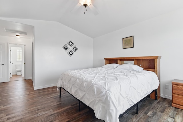 bedroom with attic access, baseboards, dark wood finished floors, and lofted ceiling