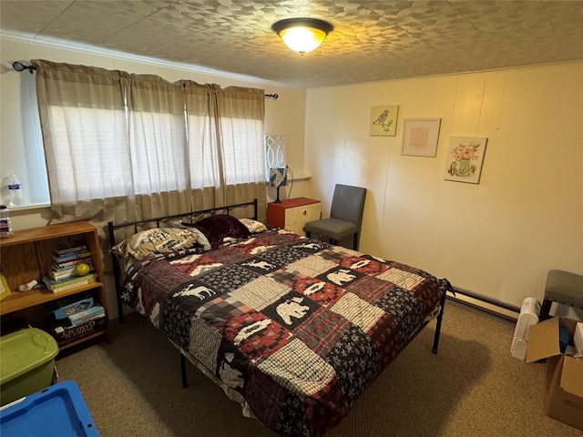 bedroom with carpet floors and a baseboard radiator