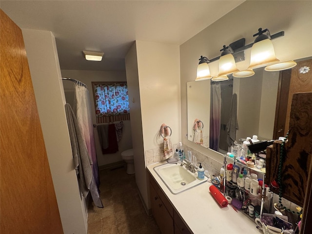 bathroom featuring toilet, a shower with curtain, and vanity