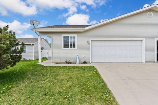view of front of property with an attached garage, concrete driveway, and a front yard