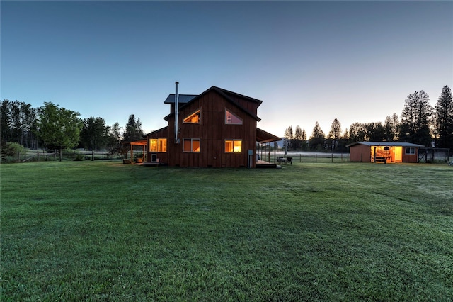 85 Martin Ln, Florence, MT 59833 - back of house at dusk featuring board and batten siding