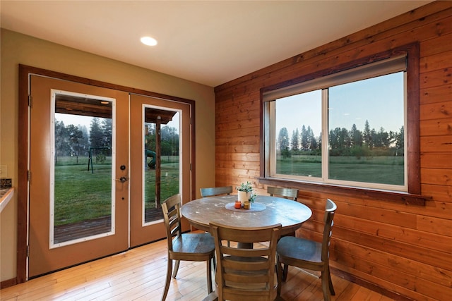 85 Martin Ln, Florence, MT 59833 - dining space featuring wooden walls, french doors, light wood finished floors, and recessed lighting