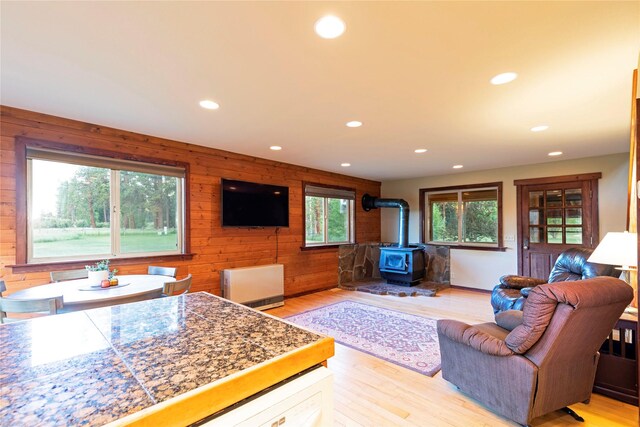 85 Martin Ln, Florence, MT 59833 - carpeted living area with wood ceiling, a chandelier, vaulted ceiling, and wooden walls