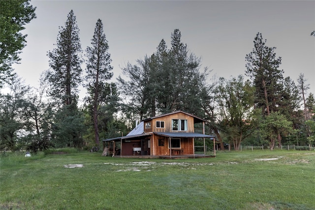 85 Martin Ln, Florence, MT 59833 - back of house featuring a lawn