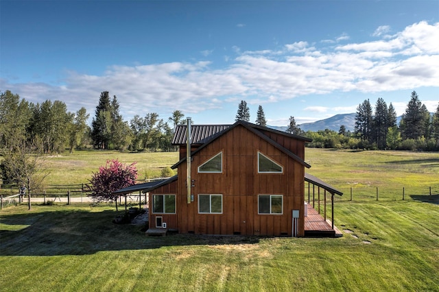85 Martin Ln, Florence, MT 59833 - view of side of home with a deck with mountain view and metal roof