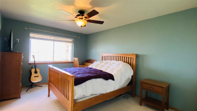 bedroom featuring ceiling fan and carpet flooring