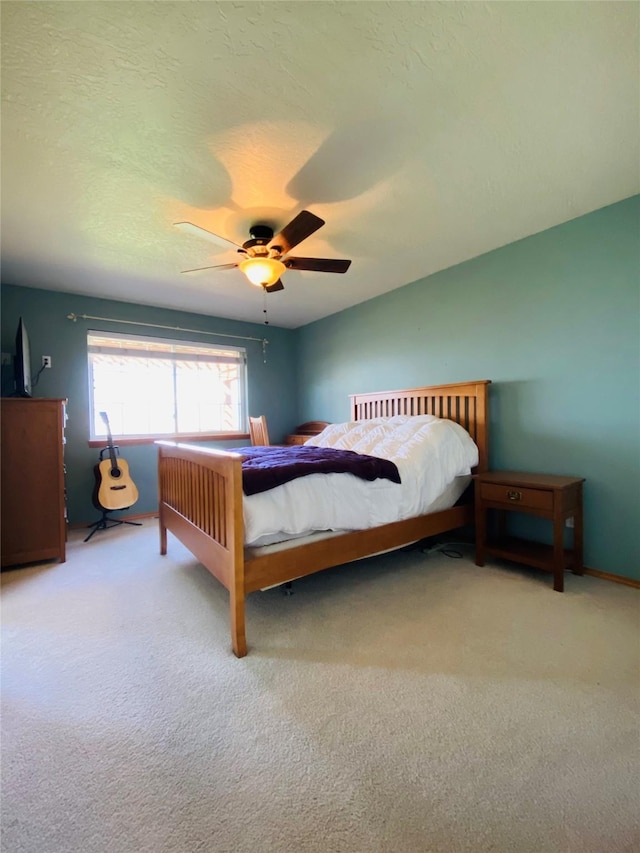 carpeted bedroom featuring a ceiling fan