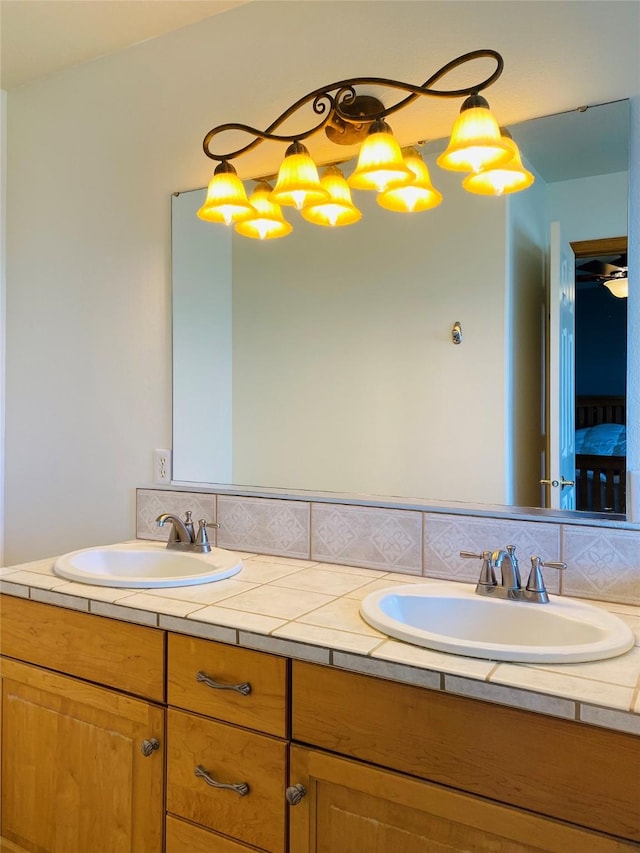 full bath featuring a sink and double vanity