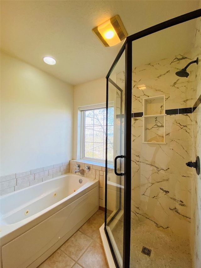 full bathroom featuring a marble finish shower, tile patterned flooring, and a tub with jets