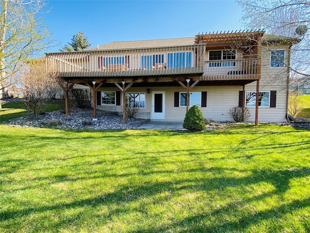 rear view of house with a lawn, a pergola, and a wooden deck