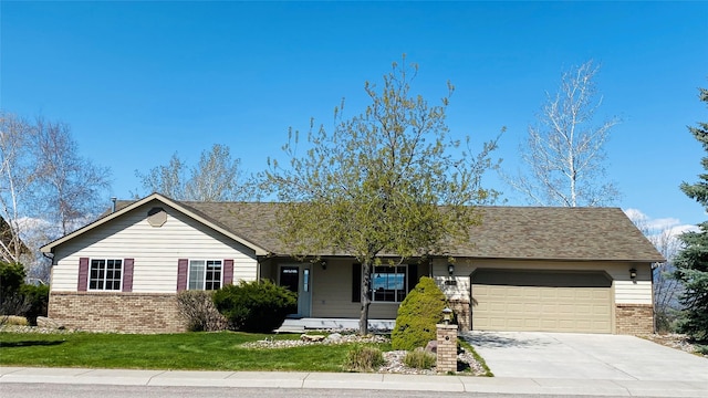 ranch-style house with concrete driveway, brick siding, a front yard, and a garage