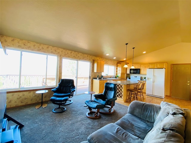living area with recessed lighting, vaulted ceiling, light carpet, and wallpapered walls