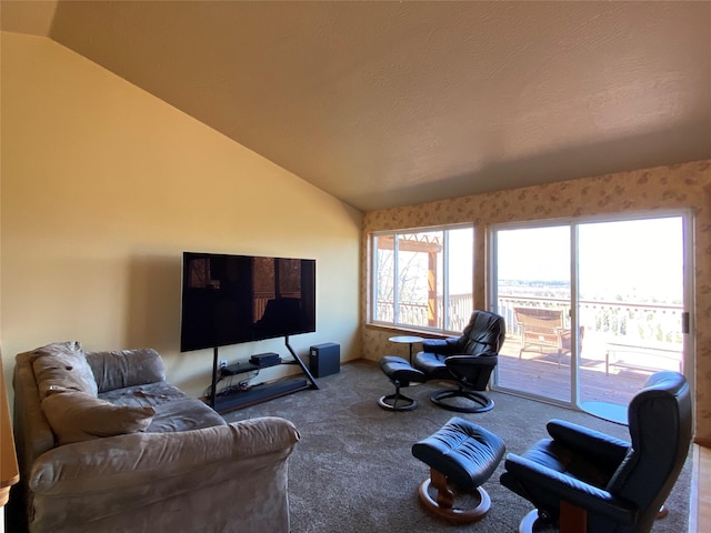 living room featuring carpet floors and lofted ceiling