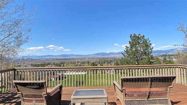 wooden deck featuring a mountain view