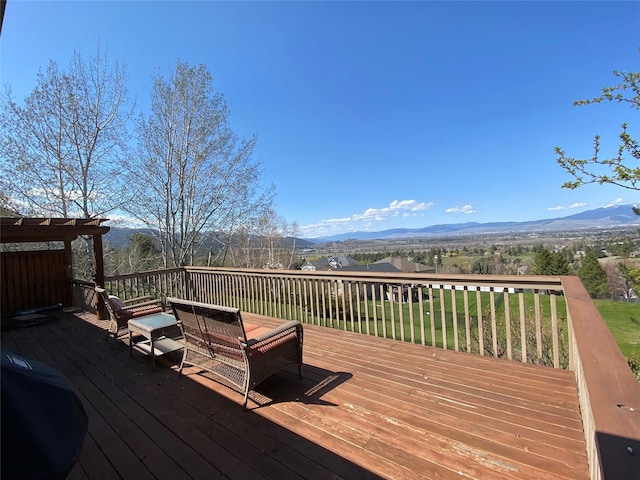 wooden terrace featuring a mountain view