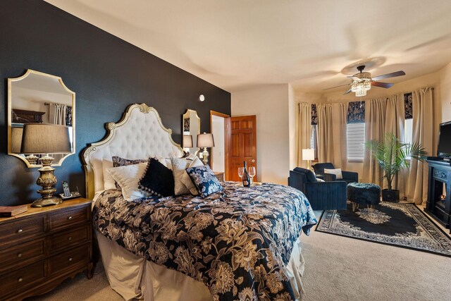carpeted bedroom with a ceiling fan