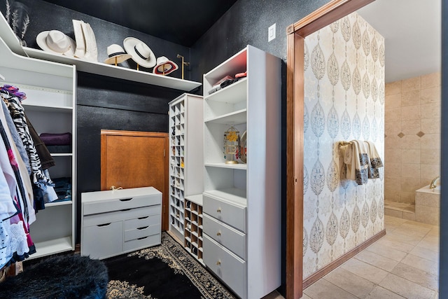 spacious closet featuring tile patterned floors