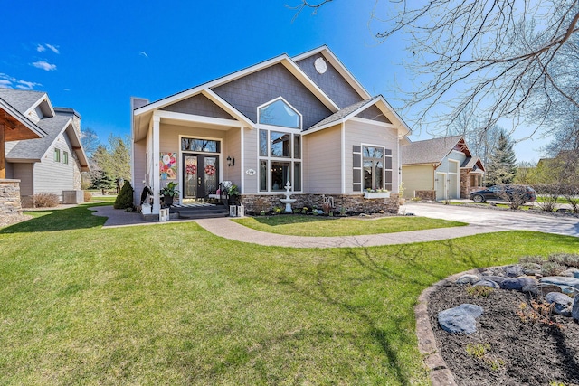 craftsman-style house with concrete driveway, central air condition unit, stone siding, and a front lawn