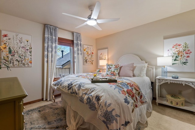 bedroom featuring light colored carpet, baseboards, ceiling fan, and access to outside