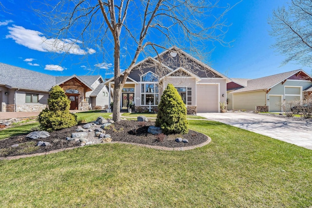 view of front of home featuring an attached garage, stone siding, concrete driveway, and a front yard
