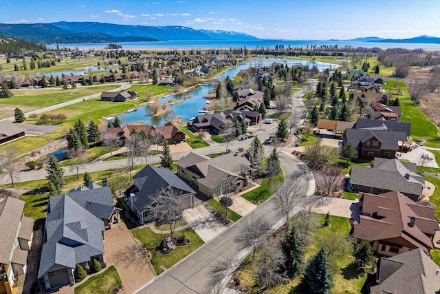 bird's eye view featuring a residential view and a water view