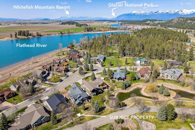 244 Harbor Dr, Bigfork, MT 59911 - bird's eye view with a residential view and a water and mountain view