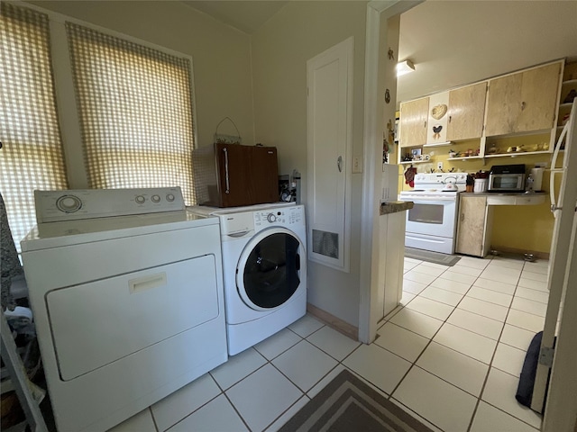 5 W 1st St, Whitehall, MT 59759 - laundry room featuring washing machine and dryer and light tile patterned floors