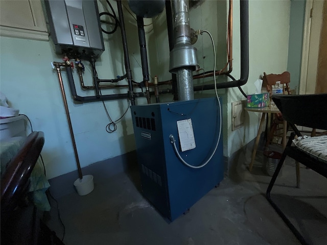utility room featuring tankless water heater and a heating unit
