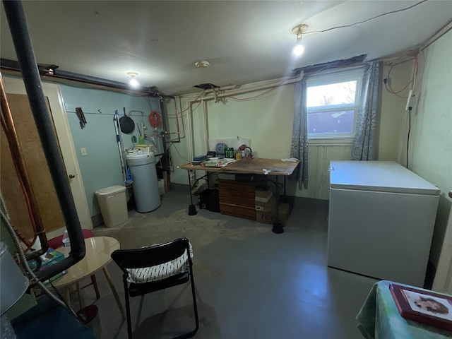 below grade area with white fridge