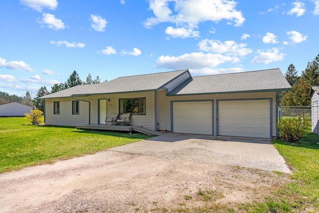 ranch-style home with a porch, a front yard, a garage, fence, and concrete driveway