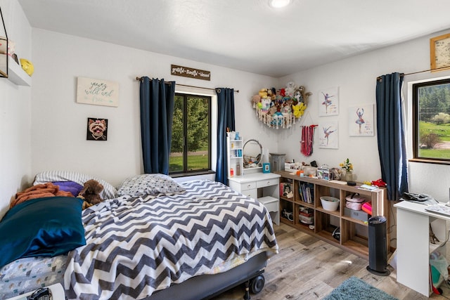 bedroom with light wood-style floors