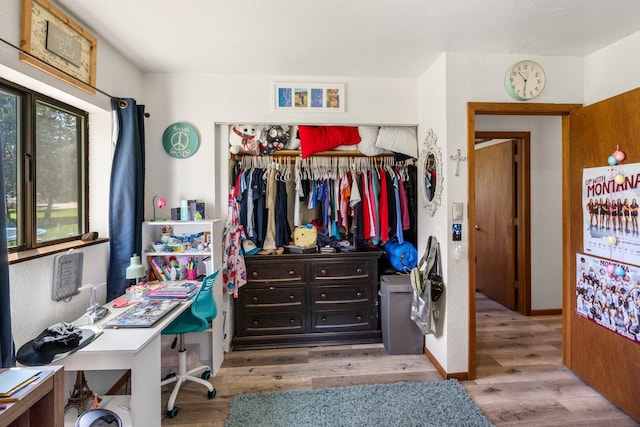 bedroom featuring a closet and wood finished floors