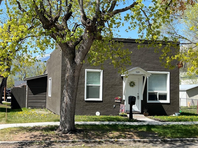 509 N 5th St, Hamilton, MT 59840 - view of front of property with entry steps, fence, and stucco siding