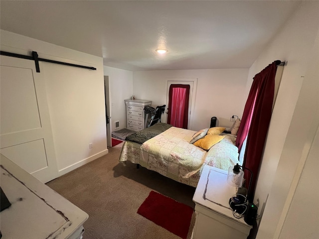 509 N 5th St, Hamilton, MT 59840 - carpeted bedroom with baseboards, visible vents, and a barn door