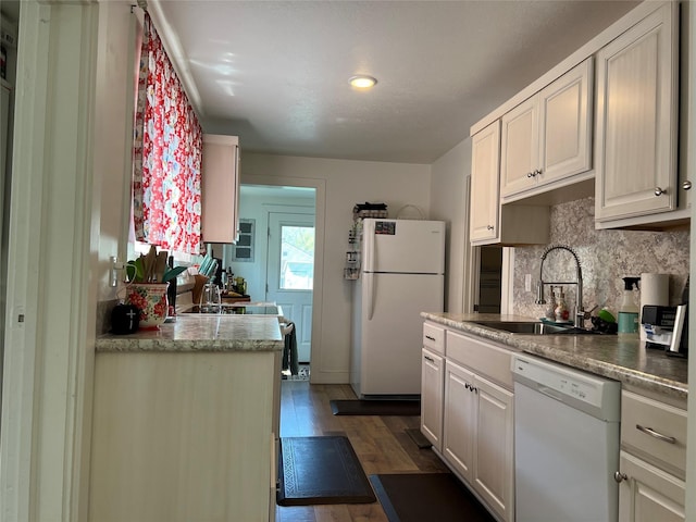 509 N 5th St, Hamilton, MT 59840 - kitchen featuring a sink, white appliances, dark wood finished floors, recessed lighting, and decorative backsplash