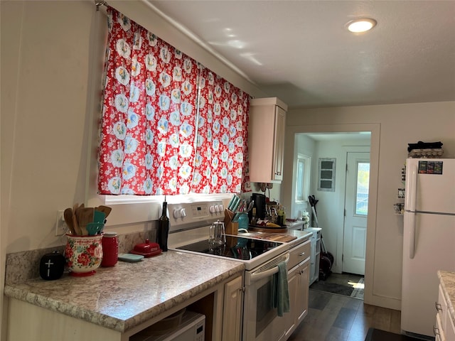 509 N 5th St, Hamilton, MT 59840 - kitchen with light countertops, white appliances, and dark wood finished floors
