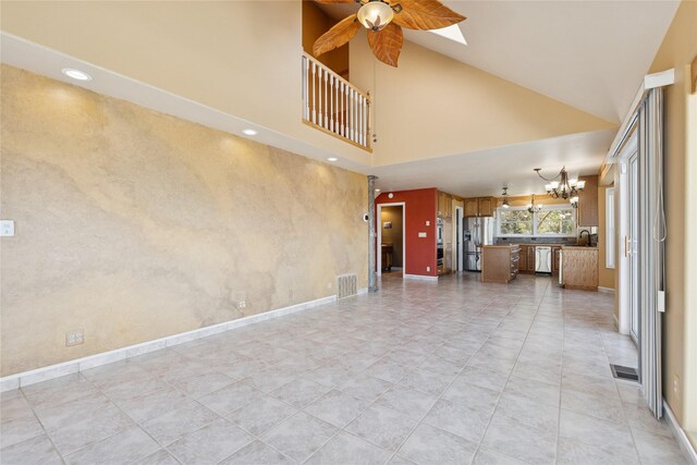 7100 Black Lake Rd, Rexford, MT 59930 - unfurnished living room with a chandelier, high vaulted ceiling, ceiling fan, and recessed lighting