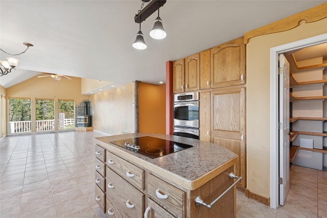 kitchen featuring open floor plan, ceiling fan, a center island, black electric cooktop, and light tile patterned floors
