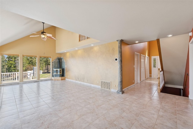 7100 Black Lake Rd, Rexford, MT 59930 - spare room with ceiling fan, high vaulted ceiling, recessed lighting, light tile patterned flooring, and a glass covered fireplace