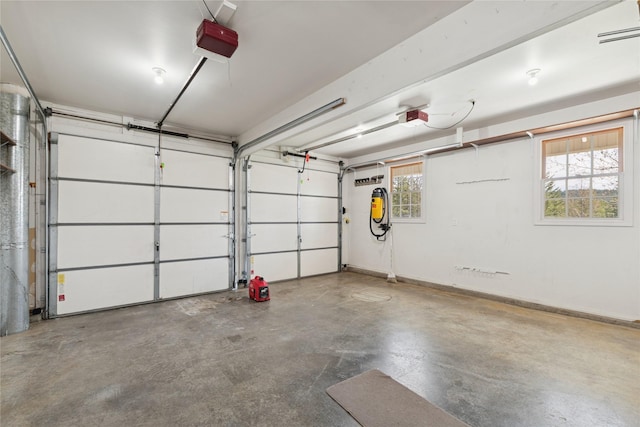 garage featuring baseboards and a garage door opener