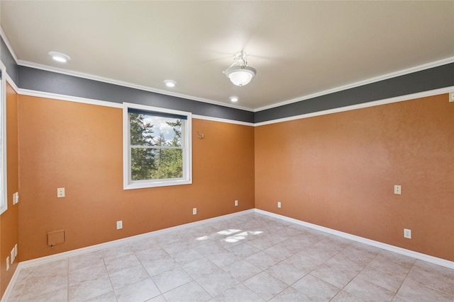 unfurnished room with crown molding, baseboards, and light tile patterned flooring