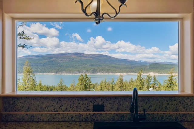 view of mountain feature featuring a water view