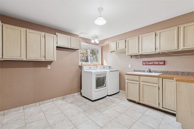 7100 Black Lake Rd, Rexford, MT 59930 - laundry area with independent washer and dryer, cabinet space, and light tile patterned flooring