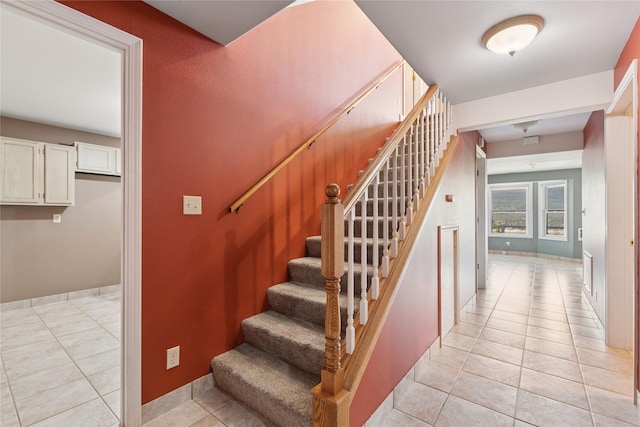7100 Black Lake Rd, Rexford, MT 59930 - staircase featuring tile patterned floors and baseboards