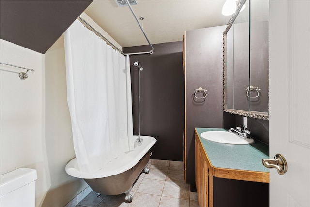 full bathroom with vanity, toilet, tile patterned floors, baseboards, and visible vents
