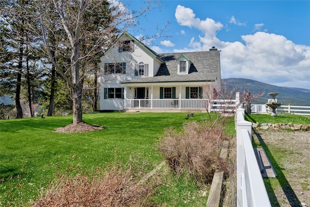 7100 Black Lake Rd, Rexford, MT 59930 - view of front of house with a porch, a chimney, and a mountain view