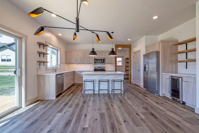 5498 Thimbleberry Loop, Helena, MT 59602 - kitchen with open shelves, appliances with stainless steel finishes, modern cabinets, and light brown cabinets