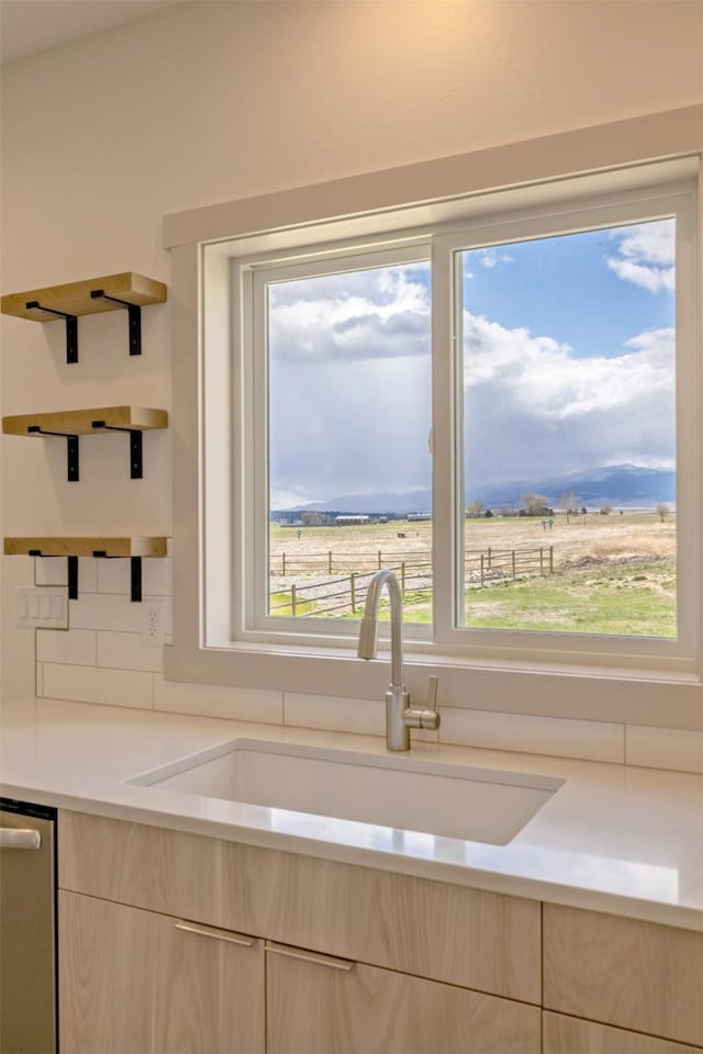 5498 Thimbleberry Loop, Helena, MT 59602 - kitchen featuring light countertops, open shelves, a sink, and light brown cabinets