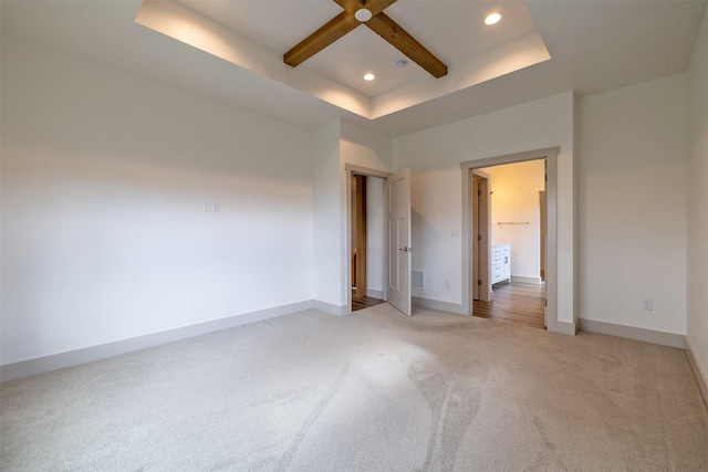 5498 Thimbleberry Loop, Helena, MT 59602 - unfurnished bedroom featuring light colored carpet, recessed lighting, baseboards, a tray ceiling, and visible vents